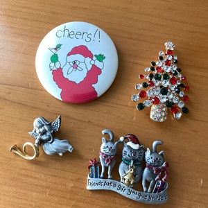 Four Christmas brooches/pins